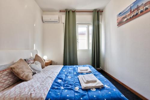 Ένα ή περισσότερα κρεβάτια σε δωμάτιο στο Cozy Miranese Venice