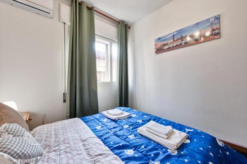 Ένα ή περισσότερα κρεβάτια σε δωμάτιο στο Cozy Miranese Venice