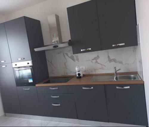 Kuchyň nebo kuchyňský kout v ubytování Luxury Home
