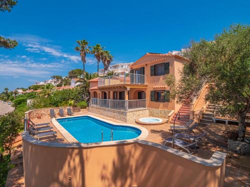 an image of a house with a swimming pool at Villa Armonia in Son Bou