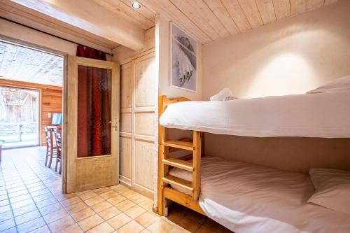 Ένα ή περισσότερα κρεβάτια σε δωμάτιο στο Appartement Flocon