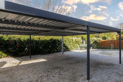a black metal pavilion in a parking lot at Twelve on Arum in Somerset West
