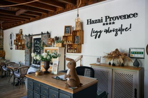 a stuffed rabbit sitting on top of a table at Hazai Provence in Kapolcs