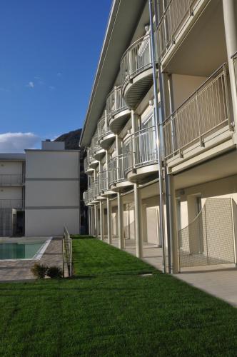 a building with balconies on the side of it at Hotel Vischi in Domaso