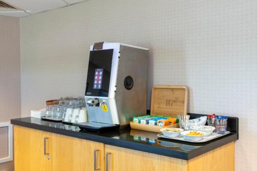 a coffee maker on a counter in an office at Holiday Inn Express London - Epsom Downs by IHG in Epsom