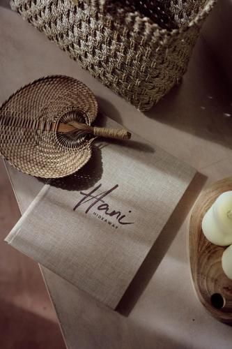 a write on a piece of paper next to a basket at Hani Hideaway in Gili Air