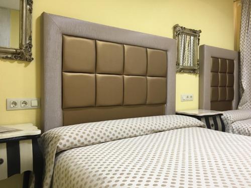 سرير أو أسرّة في غرفة في Just Style El Mañico