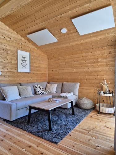 a living room with a couch and a table at 405-Tiny House Ruhr in Bleckede