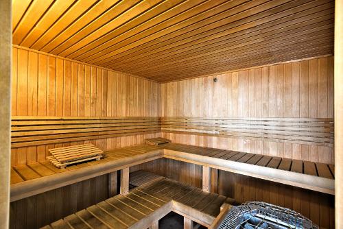 an empty sauna with wooden walls and wooden floors at Phoenix X Unit 803 in Orange Beach
