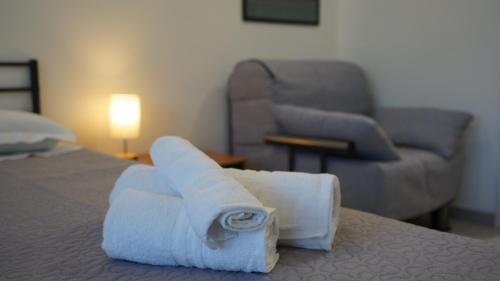 a hotel room with a bed with towels on it at La casa di Sonia in Termoli
