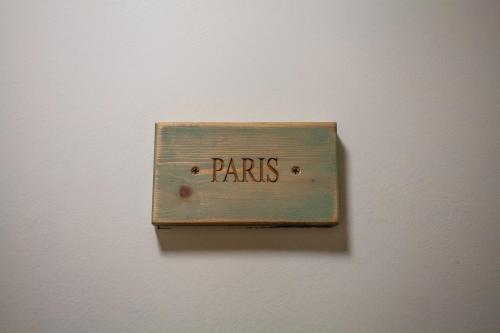 a lightswitch with the word paris on a wall at Breakwater Hostel in Newquay