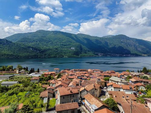 a view of a town next to a lake at Lario10 by Quokka 360 - Garden and Lake View in Abbadia Lariana