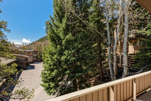 a view from the balcony of a house with trees at Aspen Alps Apartment #209 in Aspen