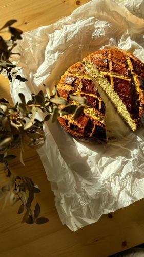 a piece of bread sitting on a piece of paper at Casa da Milheira - Agroturismo in Oliveira de Azemeis