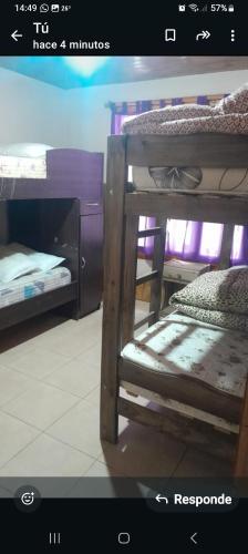 a picture of a room with two bunk beds at Cabañas Las Dunas in El Nihuil
