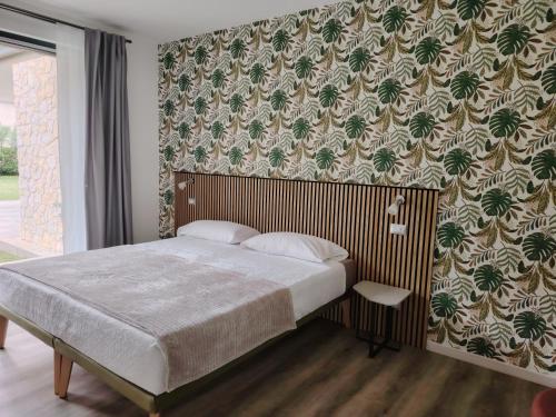 Postel nebo postele na pokoji v ubytování B&B El Rocol