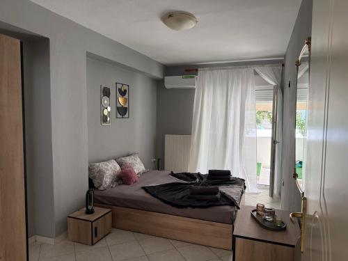 Ένα ή περισσότερα κρεβάτια σε δωμάτιο στο Odyssey Apartments