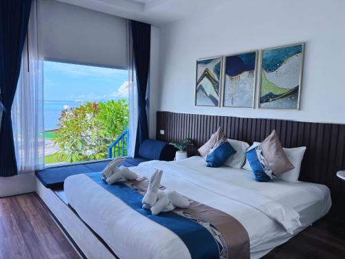 Postel nebo postele na pokoji v ubytování Three Trees Samui Resort - Sarocha Villa