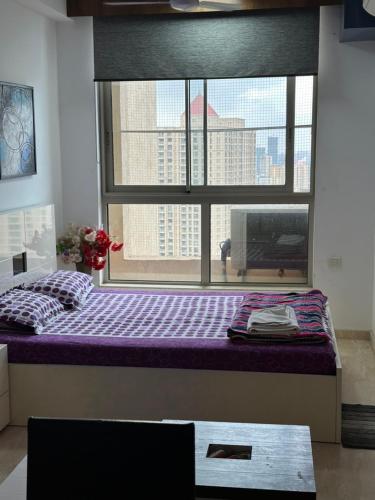 Ένα ή περισσότερα κρεβάτια σε δωμάτιο στο Cosy Studio Apartment