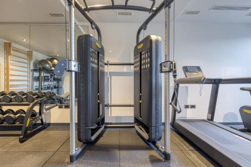 a gym with two treadmills and weights at Level 5 Rovinj - Adults Only in Rovinj