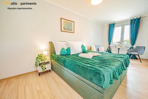 Postel nebo postele na pokoji v ubytování Baltic Apartments - Apartamenty Bałtyk Bay View