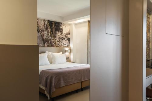 Postel nebo postele na pokoji v ubytování Serra d'Aire Boutique Hotel - SA Hotels