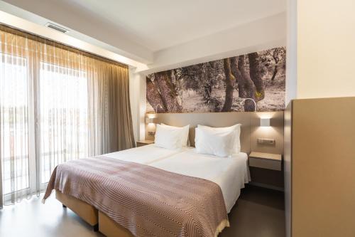 Postel nebo postele na pokoji v ubytování Serra d'Aire Boutique Hotel - SA Hotels