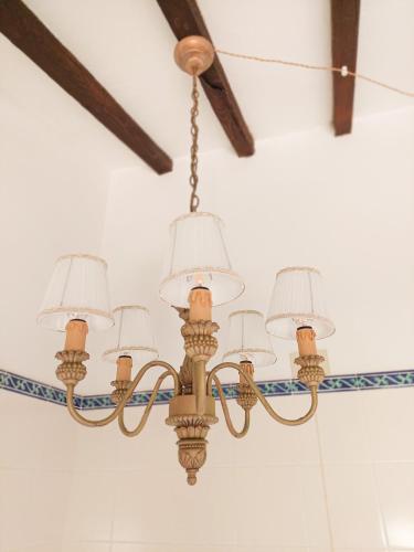 a chandelier hanging from a ceiling in a room at Dimora Gentile BnB in Castiglione del Lago