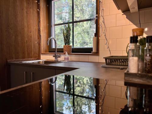 a kitchen with a sink and a window at Lindvallen Ski Resort Pool and Padel - Sauna - 6 Guests - Pet Friendly in Sälen