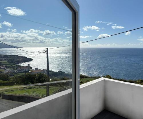 a view of the ocean from the balcony of a house at Quinta da Baía - AL in Arrife