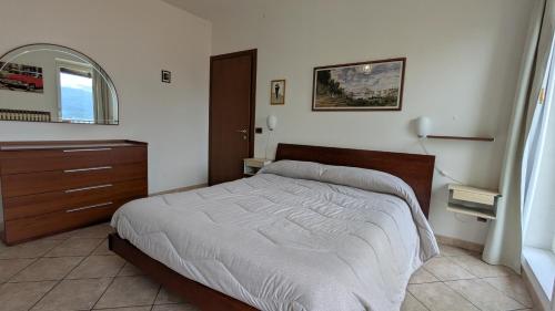 Postel nebo postele na pokoji v ubytování Sirena Vista Lago