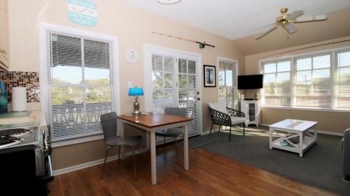 a kitchen and dining room with a table and chairs at 202 Ocean Unit 6 in Cape May Point