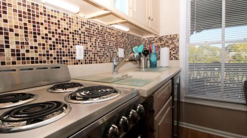 a kitchen with a stove and a sink at 202 Ocean Unit 6 in Cape May Point