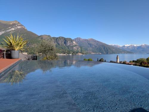 a large swimming pool with a view of a lake at Villa Cosima in Bellagio with Private Pool in Bellagio