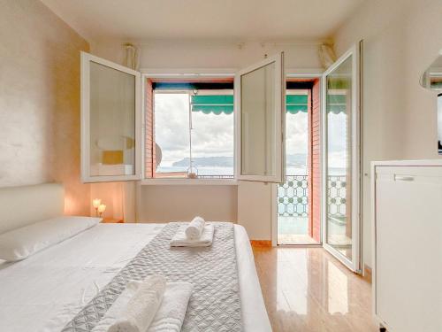 En eller flere senge i et værelse på Bergeggi Sea House