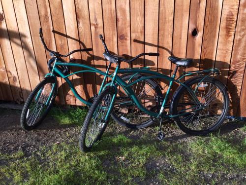 two bikes are parked next to a fence at Sequoia Resort in Badger