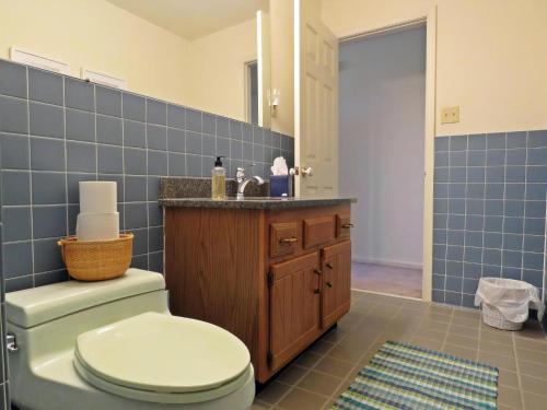 a bathroom with a toilet and a sink at 803 St James Place in Cape May