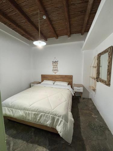 a bedroom with a large bed in a room at The View Spot in Serifos Chora