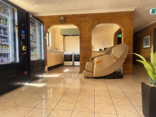 a waiting room with a chair in a store at Main Residences Southport in Gold Coast
