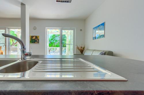 a kitchen with a sink and a counter top at Luxury Beach app P2 amazing location in Ivan Dolac