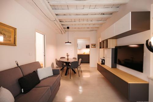 a living room with a couch and a table at Easy Flat 20 Settembre in Turin