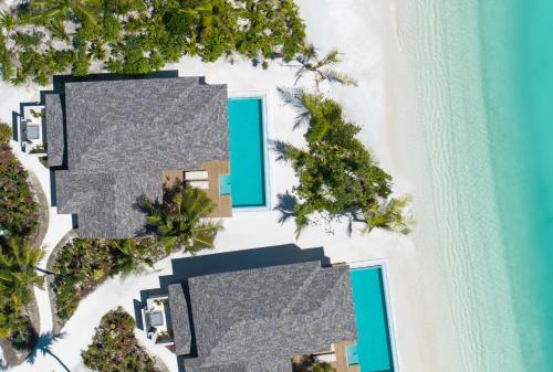 an aerial view of a resort on a beach at Ananea Madivaru Maldives in Toroka