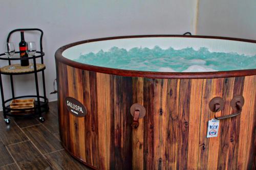 a wooden tub with a painting on the side of it at Fortuna Tropical Loft in Fortuna
