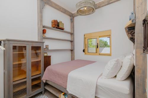 a bedroom with a bed and a window at Pefkos Eye in Pefki Rhodes
