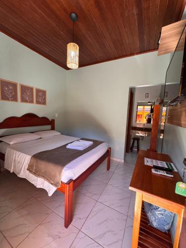 Una cama o camas en una habitación de Pousada Cabeça do Indio - Trindade