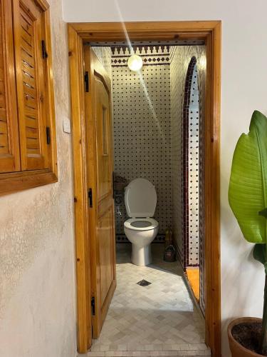 a bathroom with a toilet in a room at Taghazout Gem - 2BR, Fast Wi-Fi in Agadir