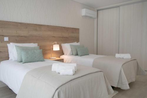 En eller flere senge i et værelse på Nina da Nazare - BY SCH