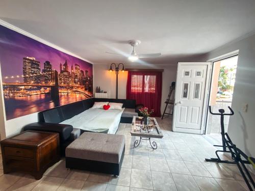 a living room with a bed and a couch at Comfort Stay in Preveza