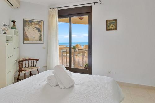 a bedroom with a bed and a view of the ocean at Pilar Luxury Apartment in Benalmádena