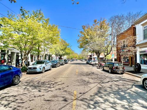 a street with cars parked on the sides of the road at Downtown, Roof Deck, Parking in Saugatuck